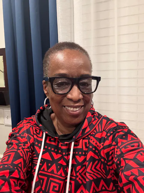 Dr. Char wearing Afropenda Shaka hoodie dress