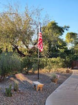 Flag scene with dedicated solar lighting