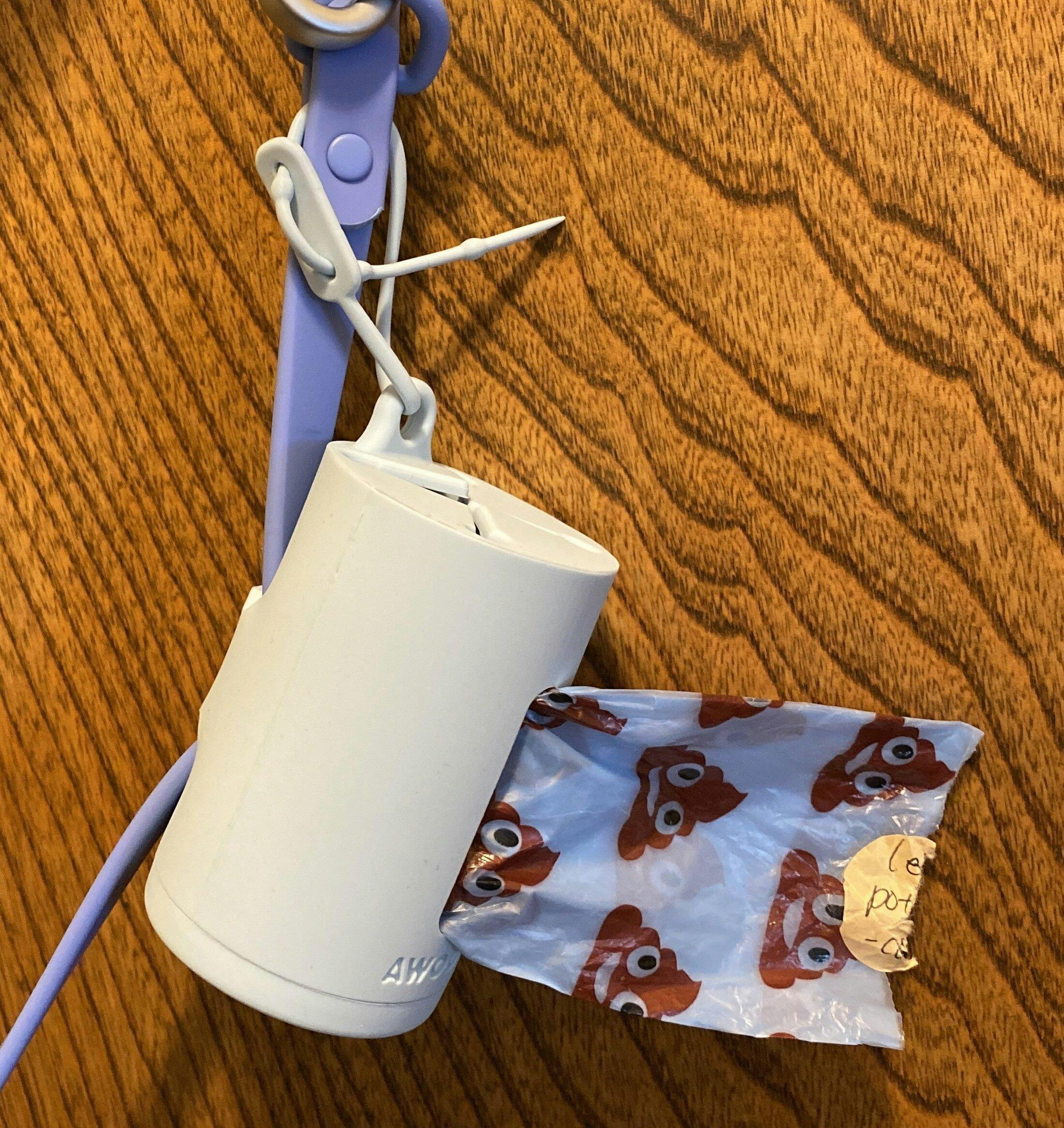 AwPoo Bag Holder: The silicone dangle-free waste bag holder for