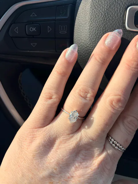 Oval Cut Diamond Engagement Ring With Pave Setting