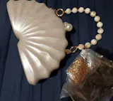 Marella Pearl Shell Clutch Bag – Elegant Acrylic Evening Handbag with Chain Strap