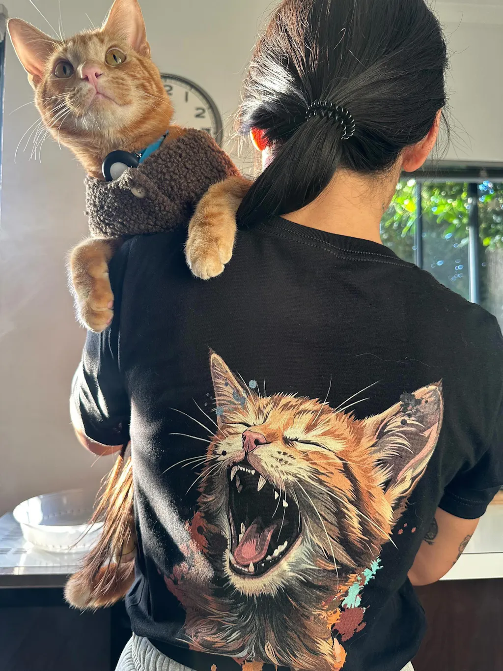 CritterFit Co customer wearing the Unbothered Yawn ginger cat tee