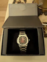 Patek Philippe Nautilus Orange Dial Stainless Steel Watch
