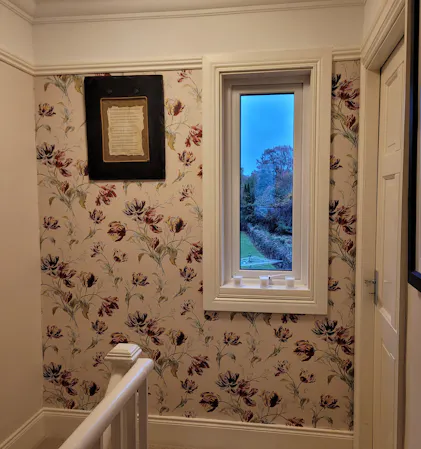 ironwork scroll cranberry wallpaper