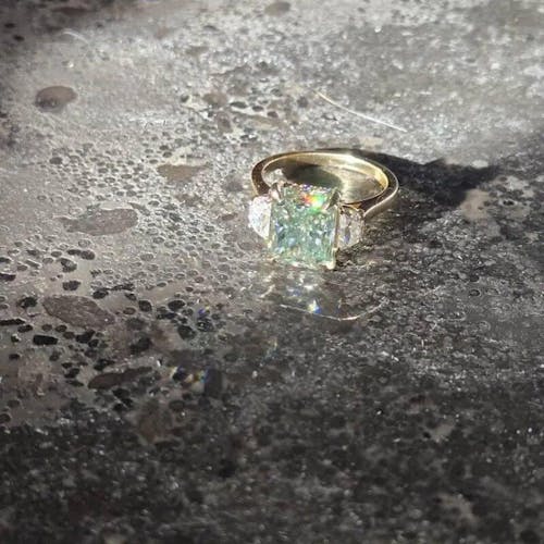 8.10 Carat Radiant Cut Light Green Moissanite Three Stone Ring