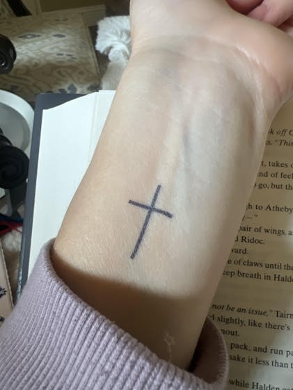 Cross Tattoo with Roman Numerals: Bold & Meaningful