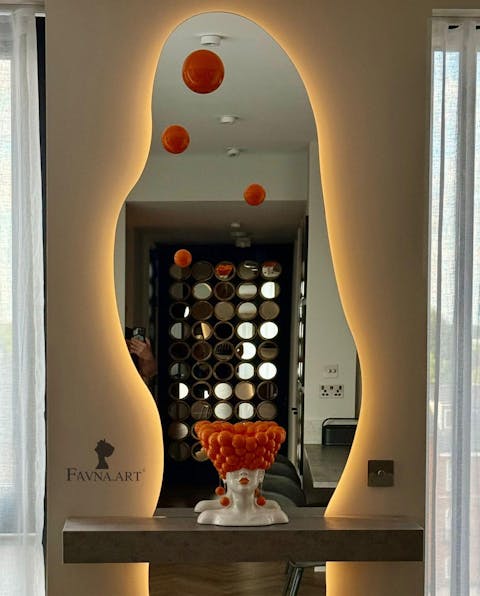 Sculpture of a woman "Thoughts" in an orange color