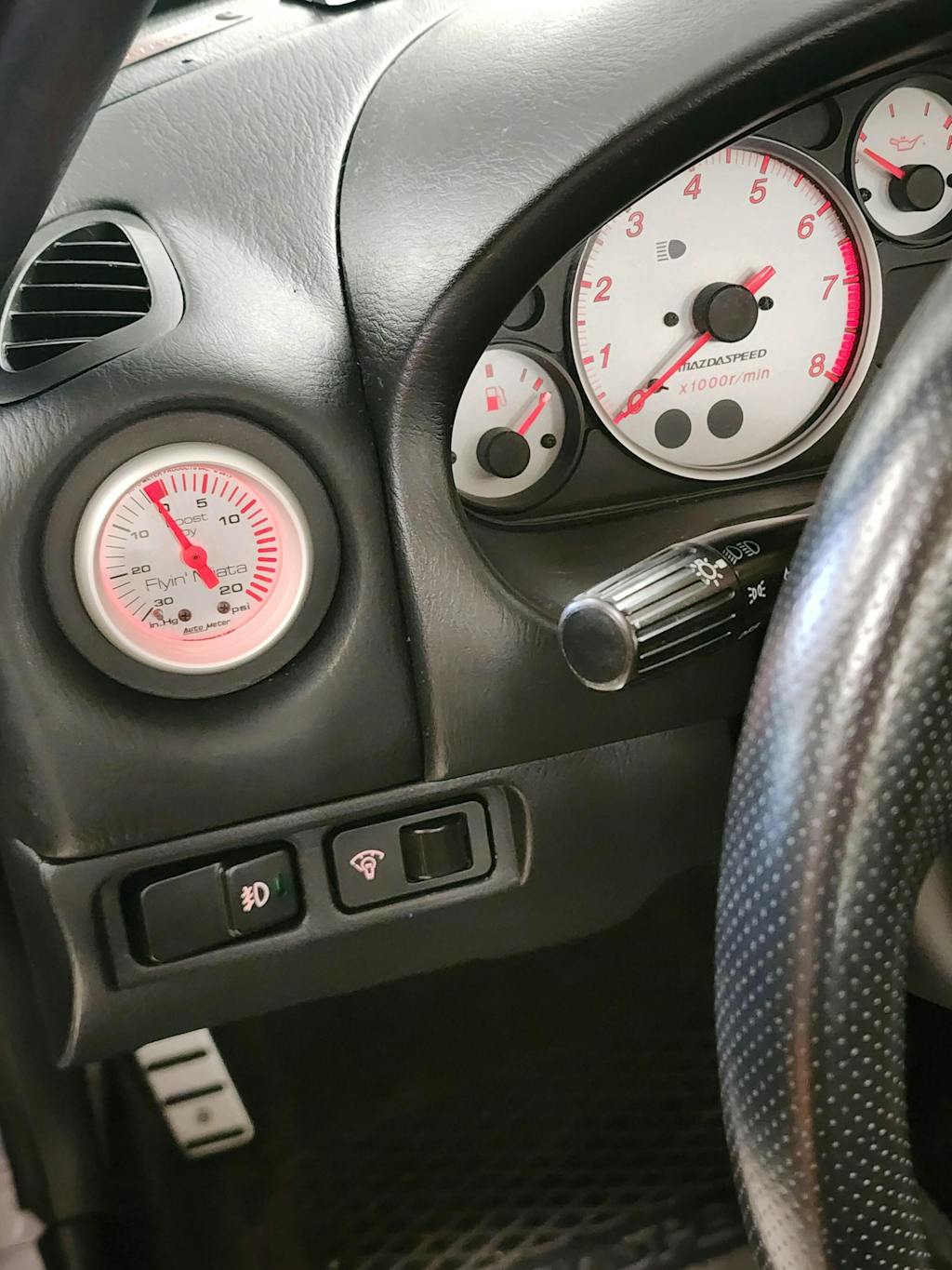 Don't want a gauge pod, but need a place to put your gauge? Flyin' Miata