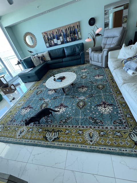 Traditional teal blue rug Persian design in teal blue, gold, green and red color