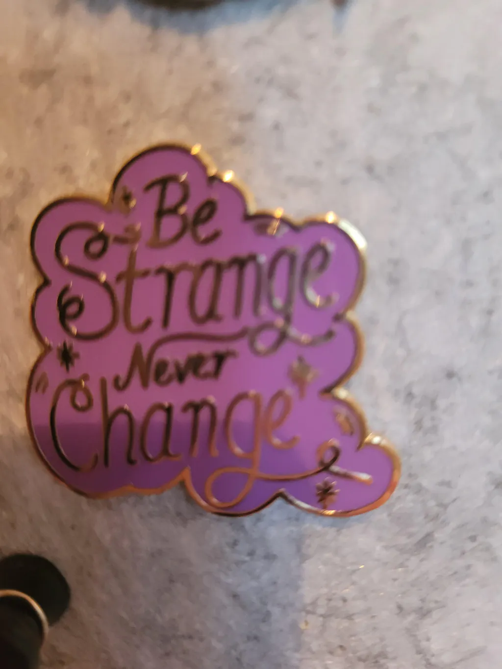 Be Strange Never Change Lapel Pin