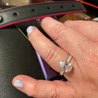 Shared Prong Pave Pear Shaped Moissanite Engagement Ring