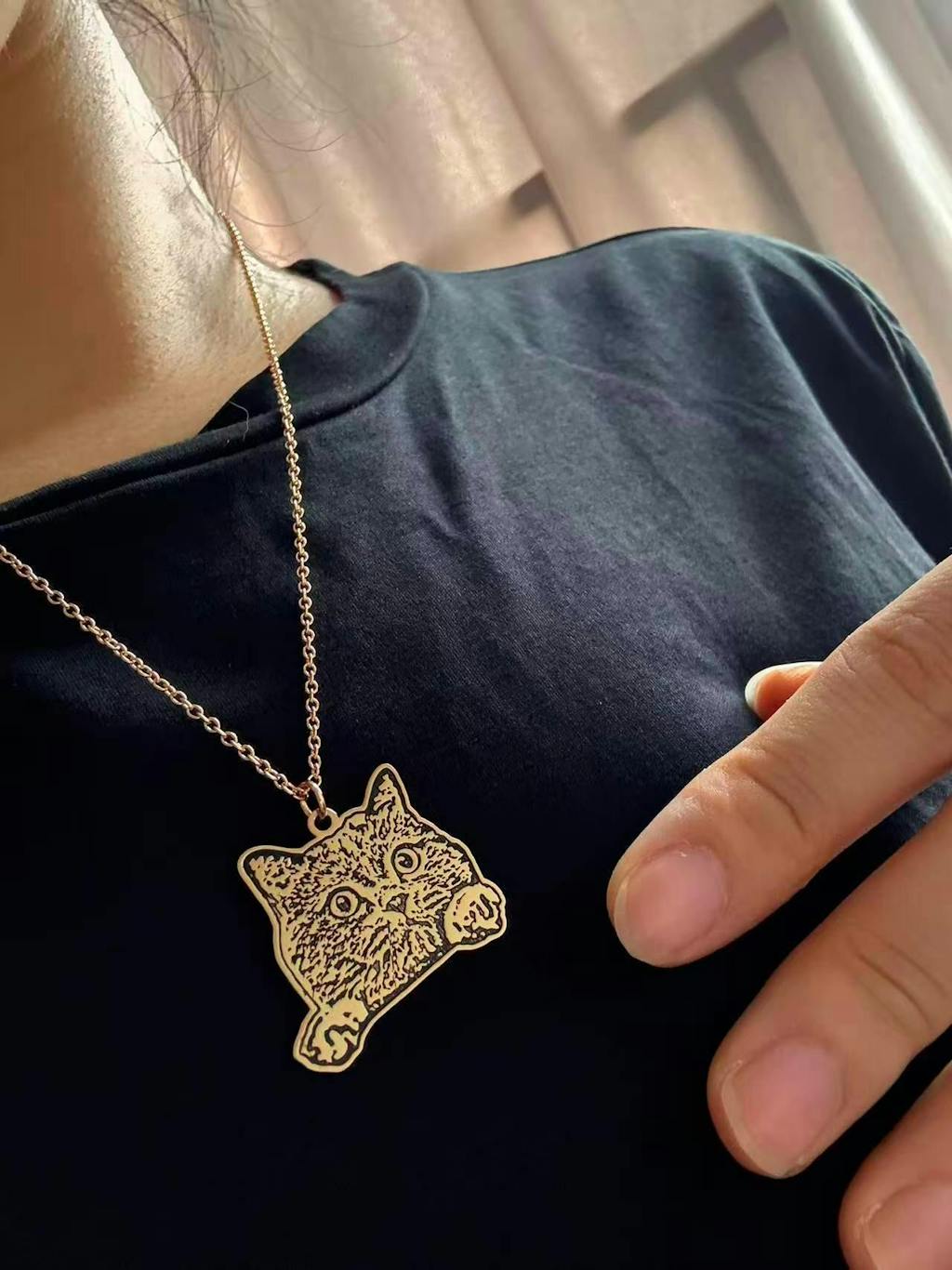 customer wearing custom pet necklace gold silhouette close-up