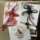 Suga Lucky Knot Keychain With Charms