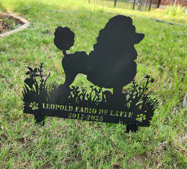 Floral silhouette garden stake in a yard