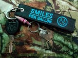 That Dude In Blue - Smiles Per Gallon Keychain - Moto Loot