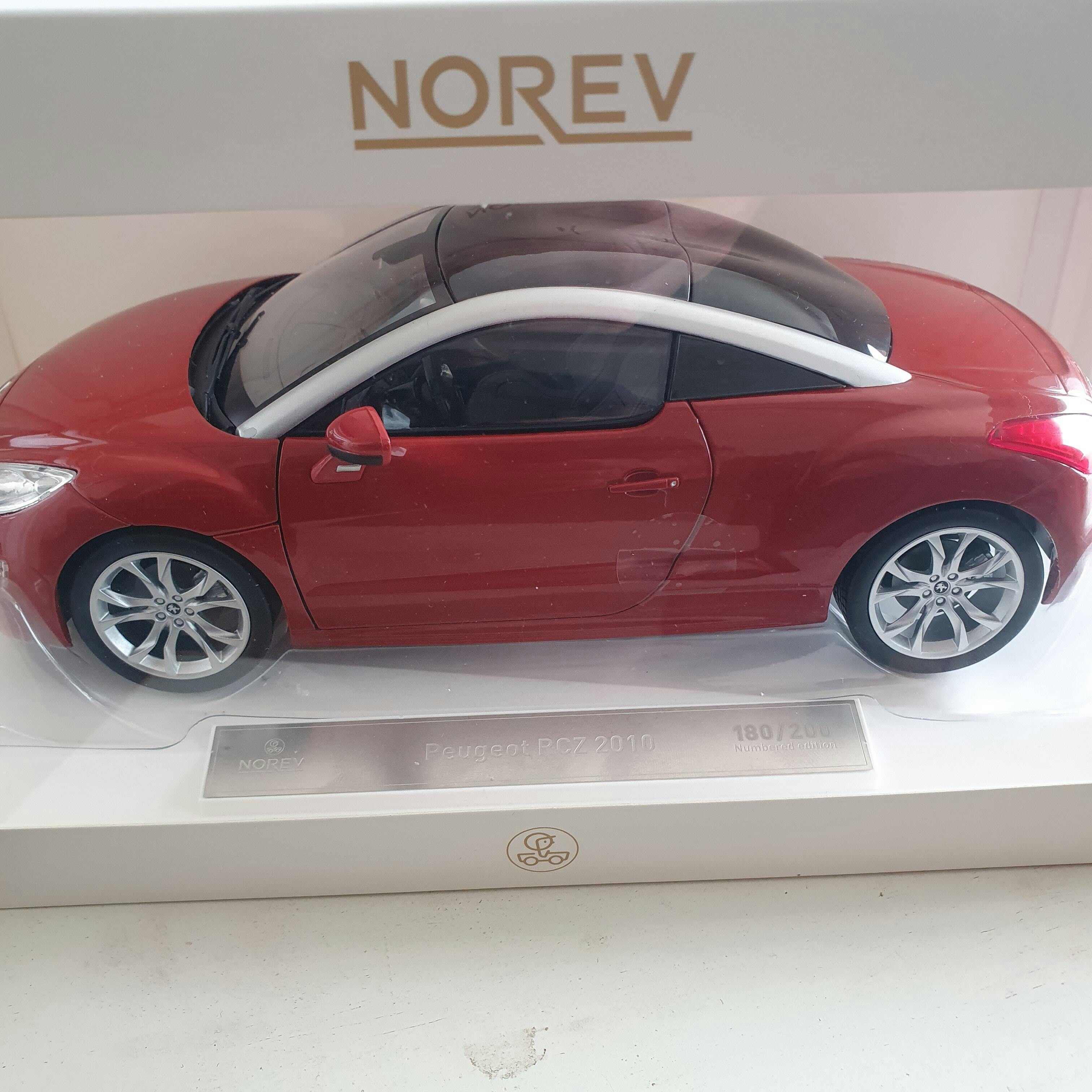 Peugeot RCZ 2010 Amber Red 1:18 - 200pcs – Norev