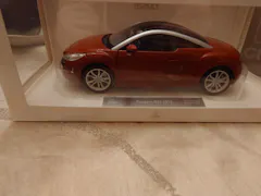 Peugeot RCZ 2010 Amber Red 1:18 - 200pcs – Norev