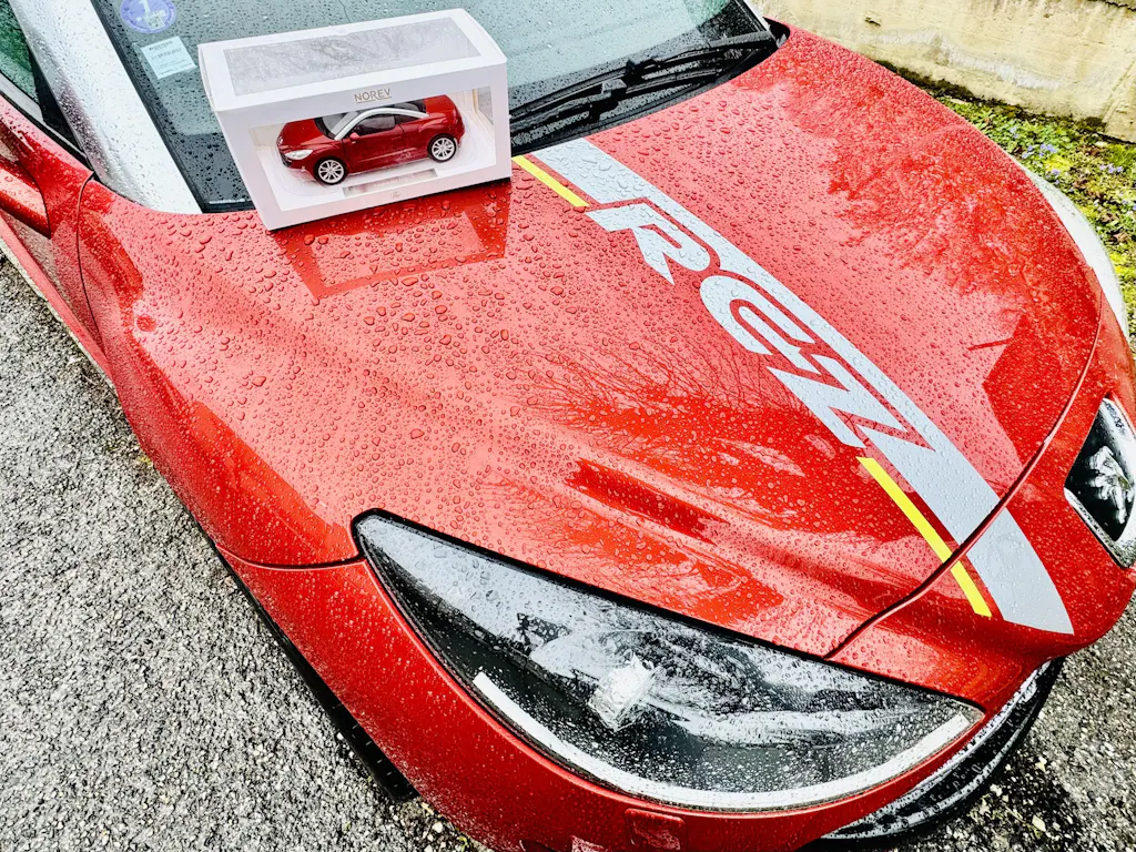 Peugeot RCZ 2010 Amber Red 1:18 - 200pcs – Norev