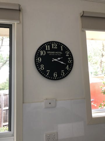 Grand Hotel Embossed Numbers Domed Metal Wall Clock, Black, 40cm