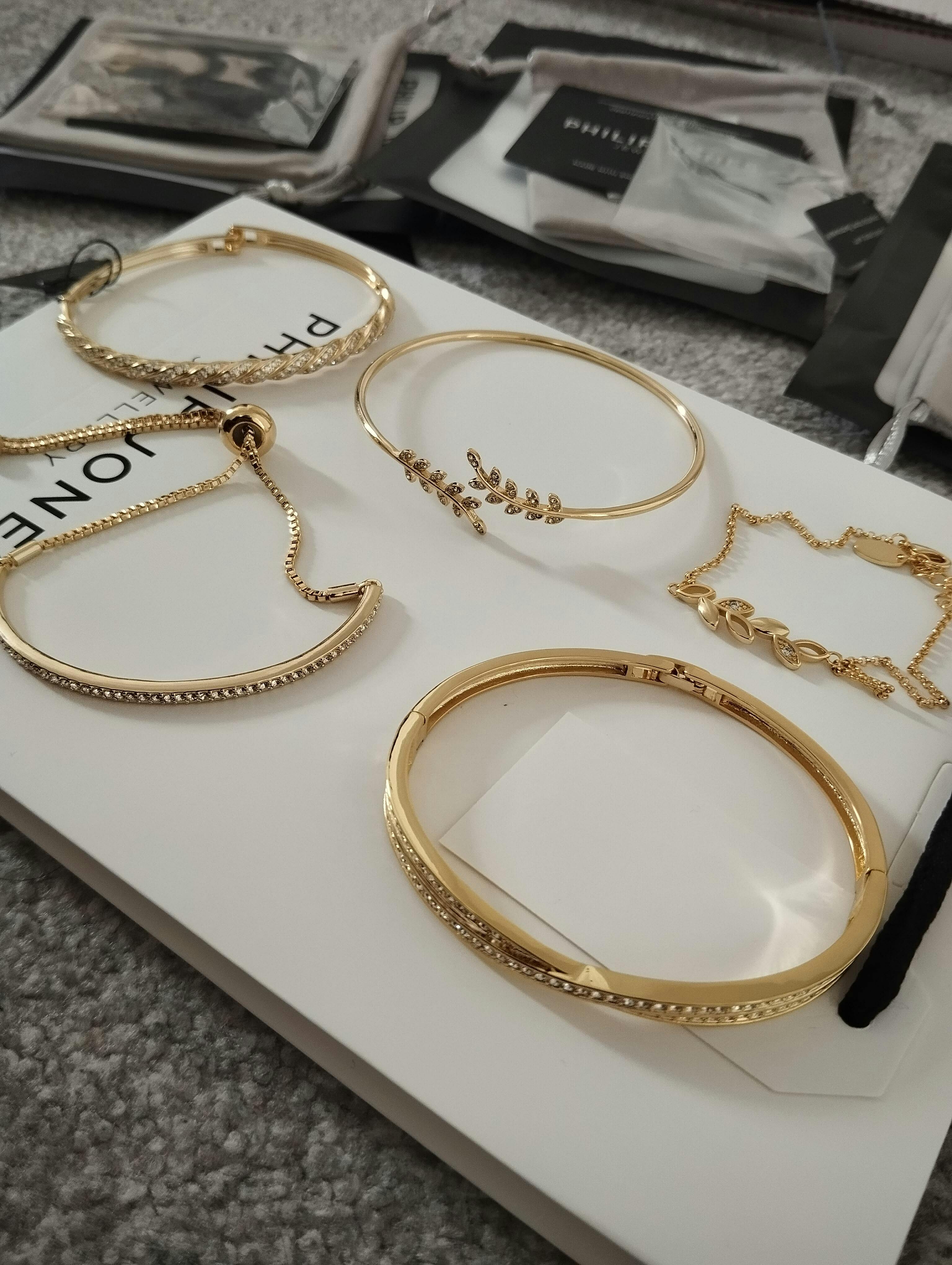 Gold Plated Twist Bangle Created with Zircondia® Crystals by