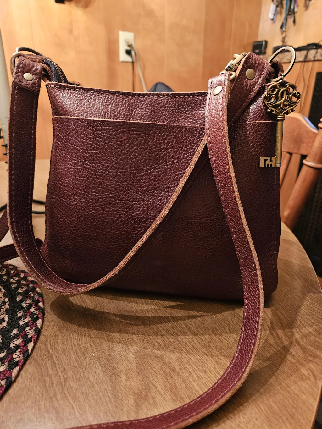TRIANGLE LOGO SHOULDER BAG 24 IN BLACK SMOOTH CALFSKIN