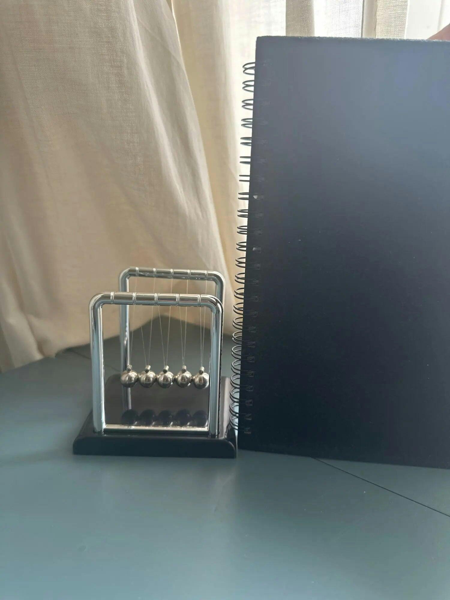 Customer photo for Newton's Cradle — Executive Desk Physics Demonstrator