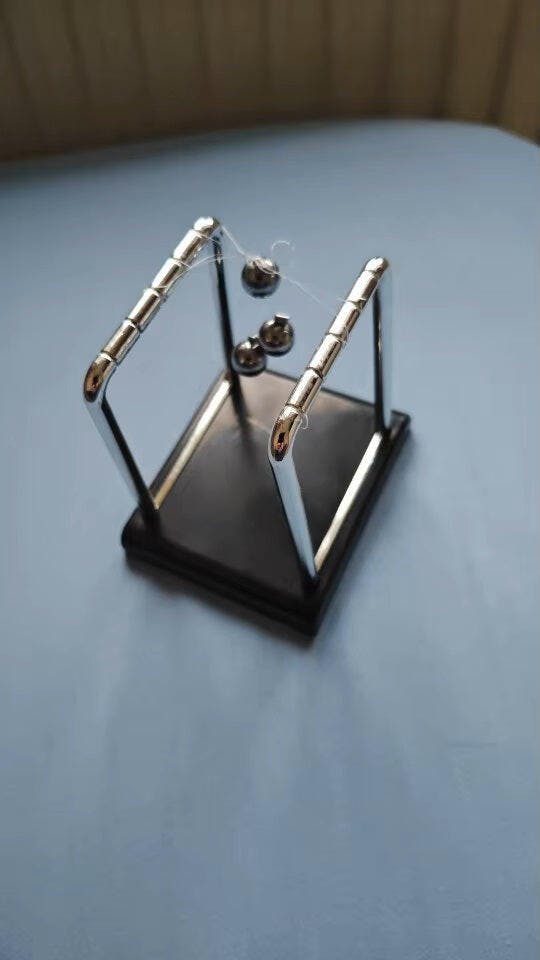 Customer photo for Newton's Cradle — Executive Desk Physics Demonstrator