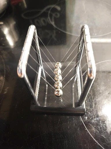 Customer photo for Newton's Cradle — Executive Desk Physics Demonstrator