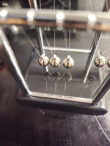 Customer photo for Newton's Cradle — Executive Desk Physics Demonstrator