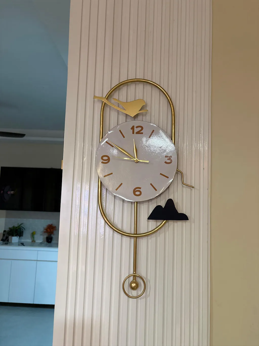 Modern wall clock with bird