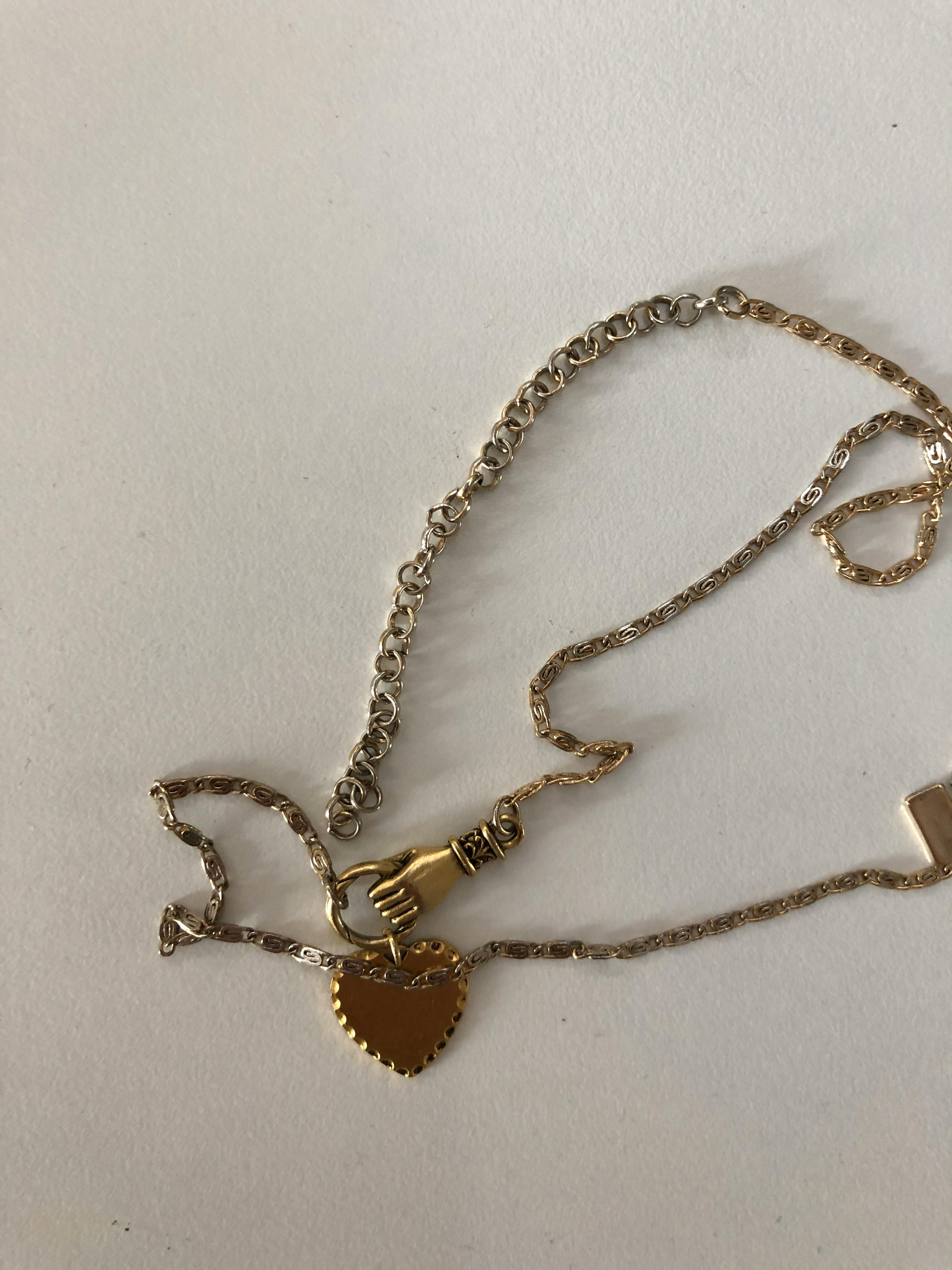 HAND OF GLORY. Grasping Heart Necklace 