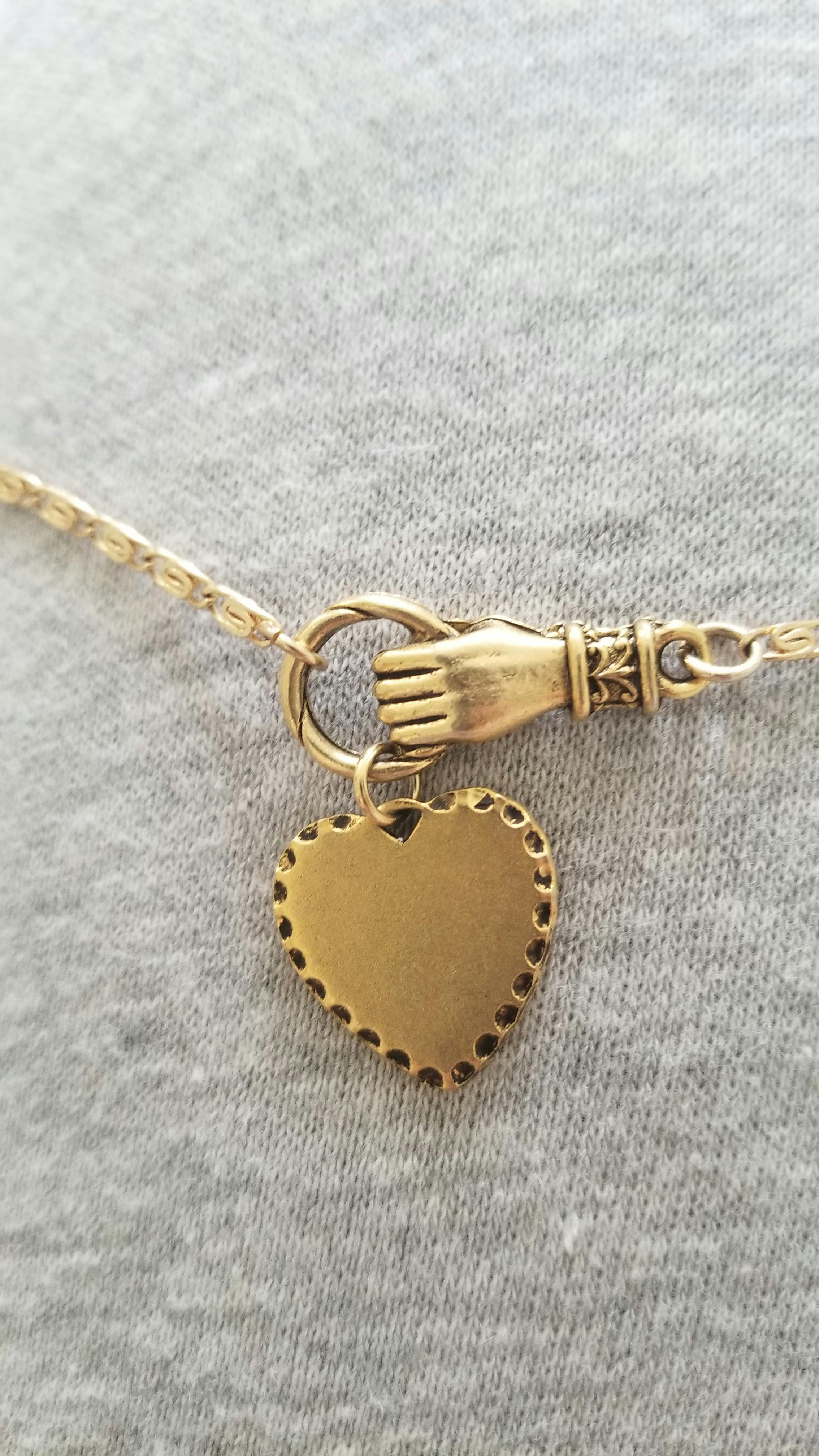 HAND OF GLORY. Grasping Heart Necklace 
