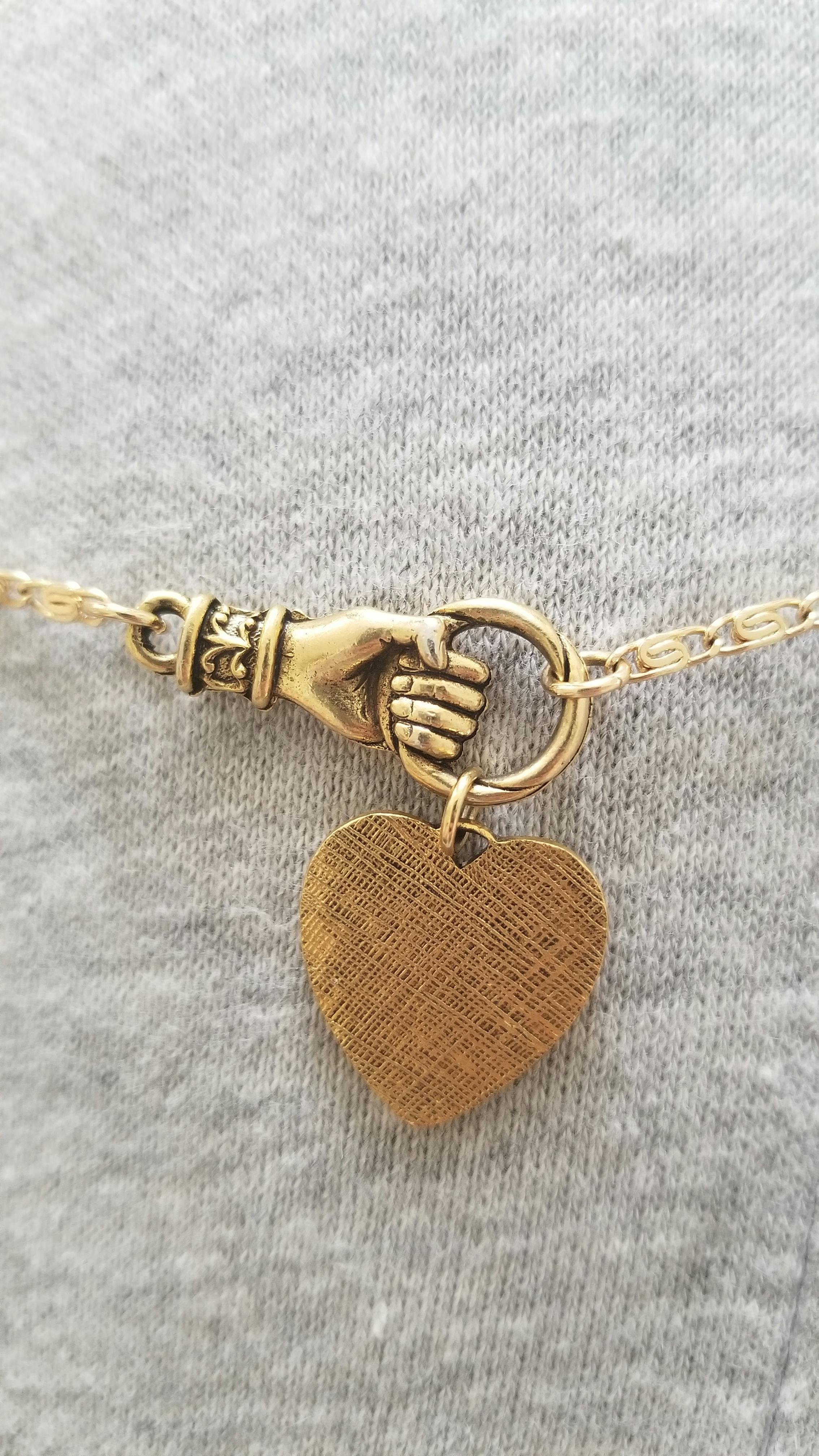 HAND OF GLORY. Grasping Heart Necklace 