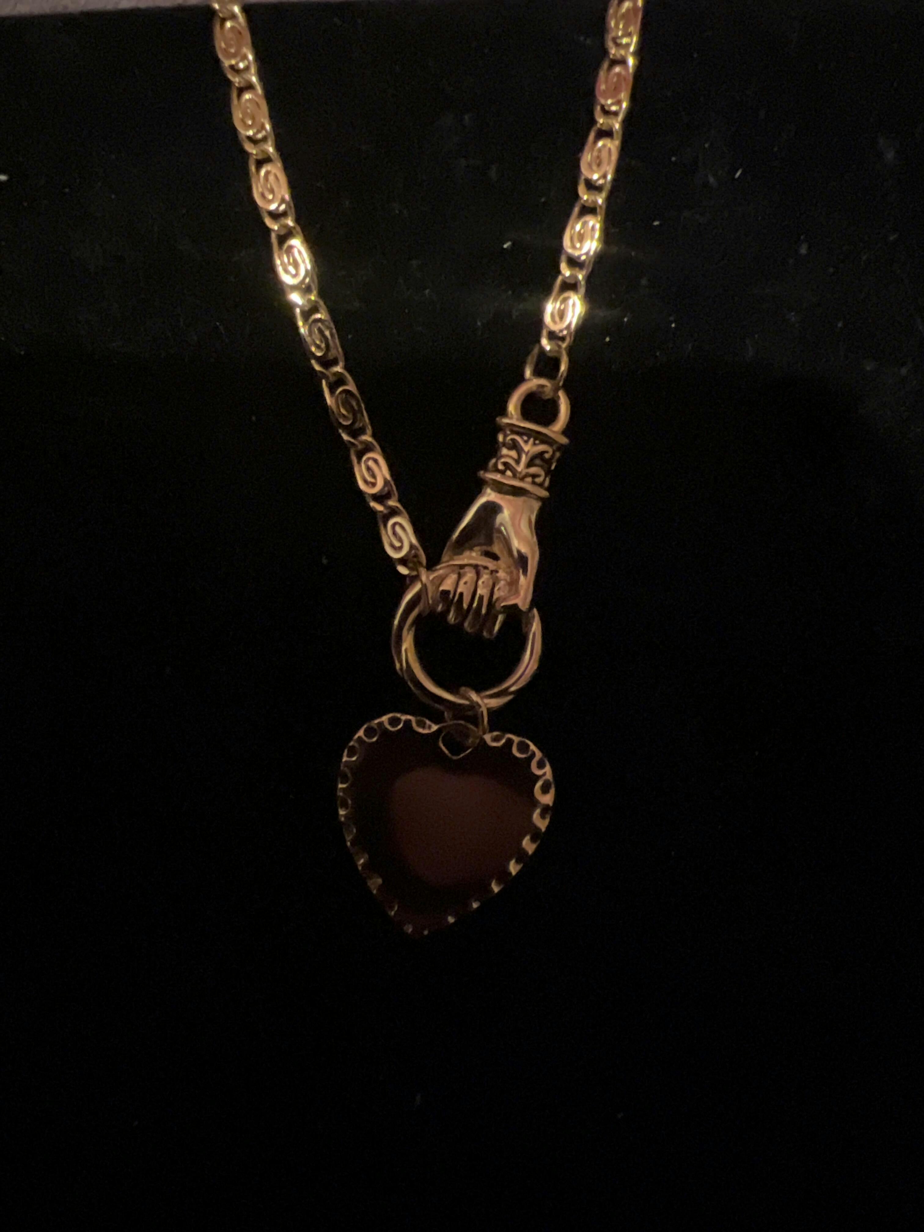 HAND OF GLORY. Grasping Heart Necklace 