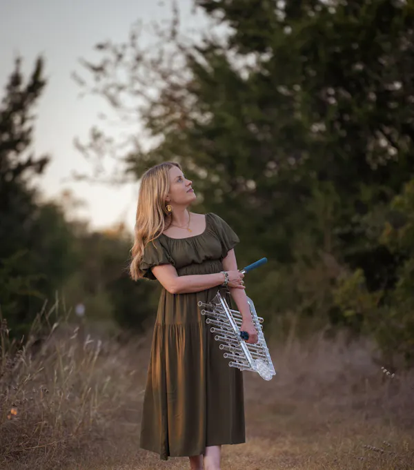 Customer with Earth Om C# Crystal Harp at sound healing session