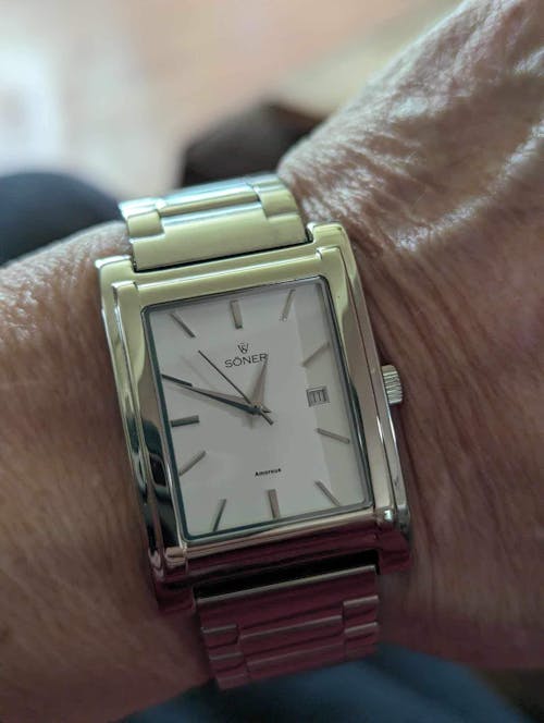 Tokyo, a rectangular watch in polished steel with green dial