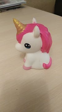 Squishy little unicorn sitting