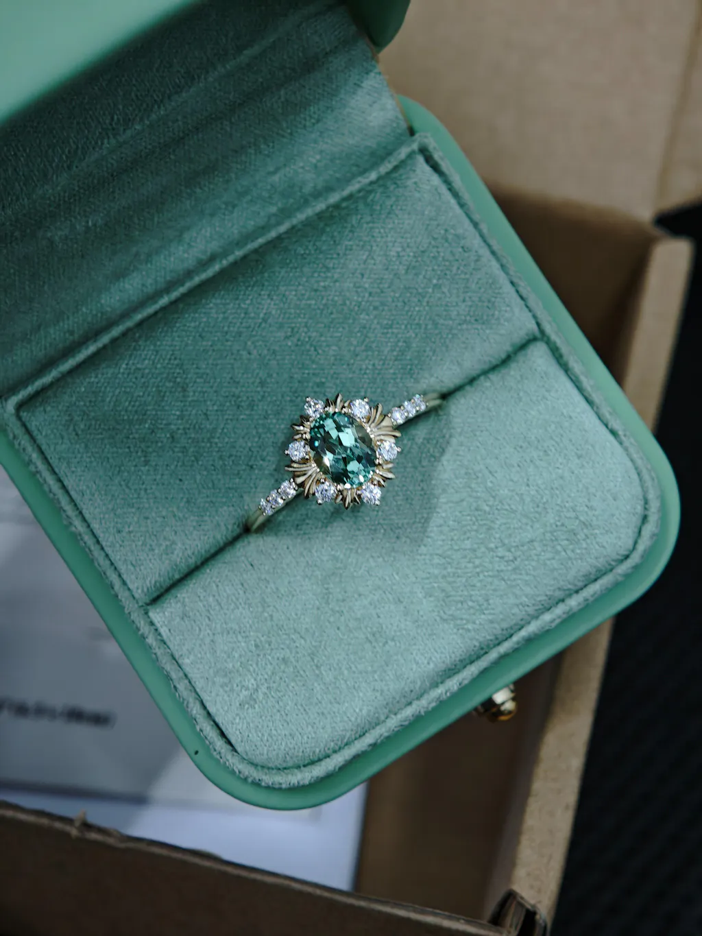 Enshrined Glow | Vintage Oval Cut Emerald Halo Engagement Ring