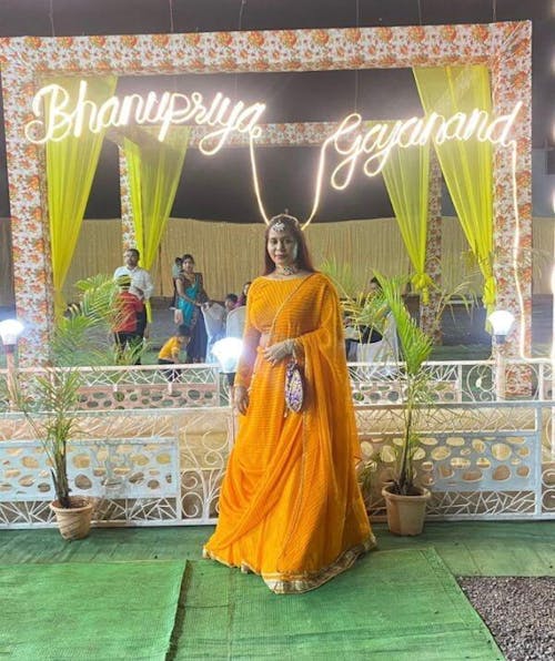 Enchanting Orange Laheriya Print Georgette Designer Lehenga Choli