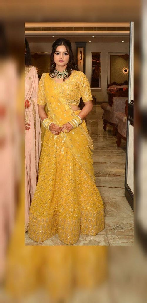 Alluring Yellow Sequins Georgette Haldi Wear Lehenga Choli